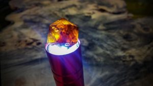 Amber glows when held to a light.